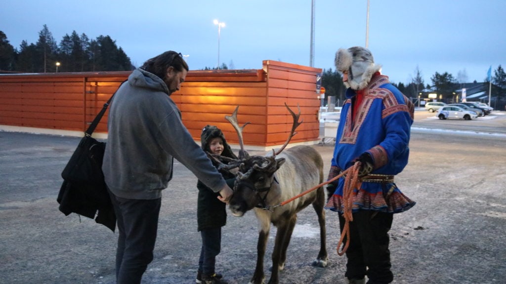 Saying hello to the reindeer at the airport