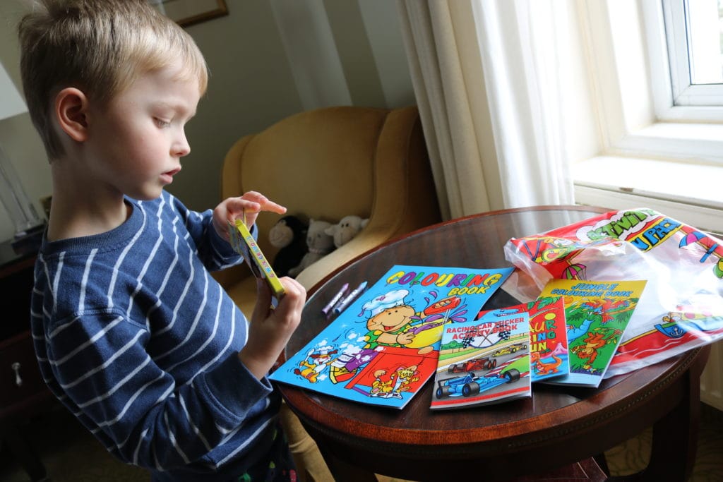 Admiring his activity pack