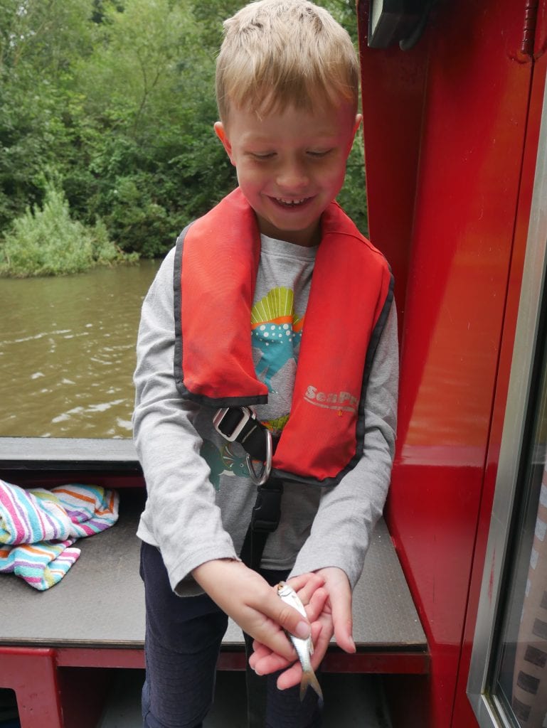 Proudly holding one of the fish we caught